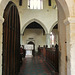 high easter church, essex,south door to church through c16 porch, c11 norman doorway into big norman church with c14 north aisle and c16 clerestory and roof. well carved font of c.1390