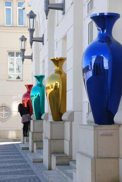 Row of reflective vases