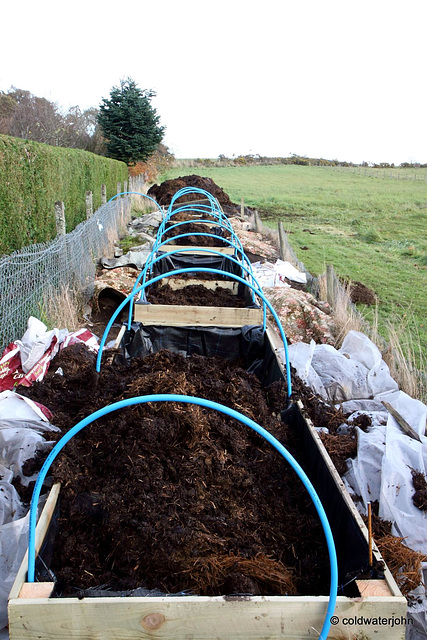 Stage Three: Fill the raised beds with a thick layer of farmyard manure...