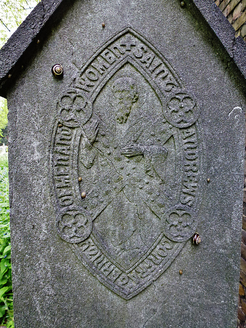 brompton cemetery, london,sigil of the confraternity of men and women of st.andrews, wells st., on the side of a member's tomb.