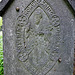 brompton cemetery, london,sigil of the confraternity of men and women of st.andrews, wells st., on the side of a member's tomb.