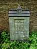 brompton cemetery, london,base of a broken cross, maybe early c20?, a memorial to a member of the  confraternity of men and women of st.andrews, wells st., that repository of high victorian arts that was bodily moved from the middle of town to the outer d