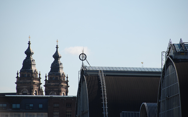 A trip with the steam tug Adelaar: Amsterdam Central Station and St. Nicolas Church