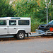 Land Rover with a race BMW on tow