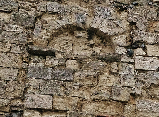 st.mary, sandwich,this small battered early c12 tympanum seems to have been that to the stair leading to the central tower, which fell in 1668. it is now high in the west front.