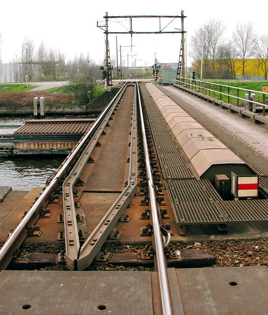 Rail bridge at Alphen aan den Rijn with mechanical sign