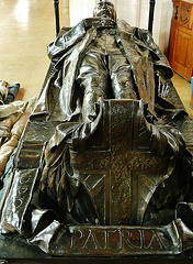 all hallows barking, london, effigy by cecil thomas, 1923, of alfred forster, as a war memorial for all the ww1 dead. the sword by his side shows that a romantic idea of death in battle still lingered, even after the trenches.