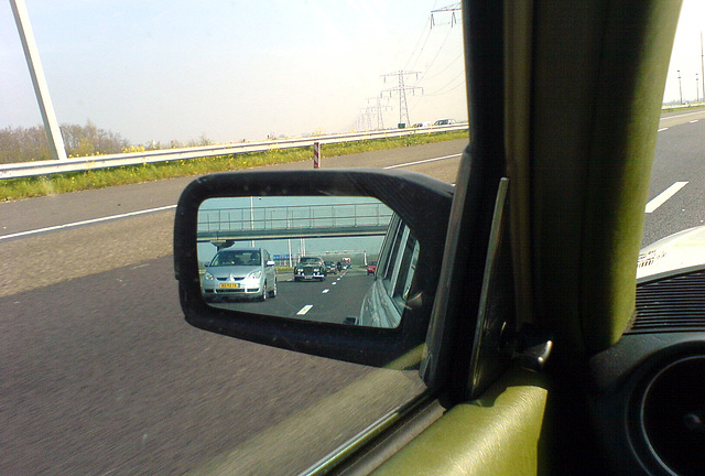 1964 Rolls-Royce Silver Cloud III in the side-view mirror