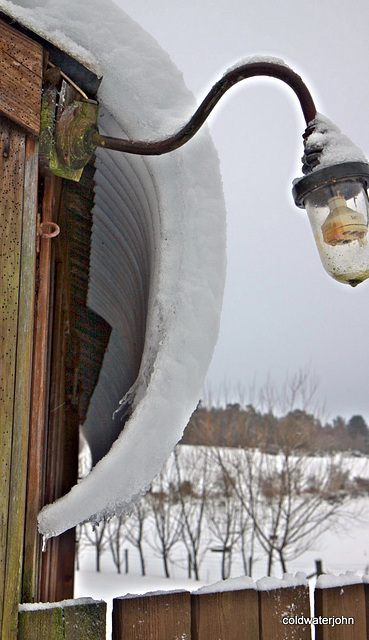 Roof snow frozen solid as it avalanches off!