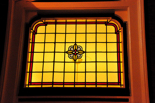 Stained-glass window above a door in Leiden