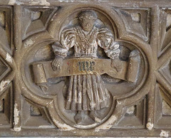 bury st. edmunds , st.mary's church, suffolk,the 1467 monument to john baret bears this small figure of the merchant in life holding his motto on a scroll and wearing the lancastrian ss livery collar