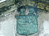 brompton cemetery, london,detail of an unknown c19 mausoleum, the owner's wife's mother claiming illegitimate royal descent on the arms over the door, with a baton sinister over the royal arms.