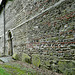 castle rising church, norf.north side of nave, with blocked c12 doorway and large stone footings