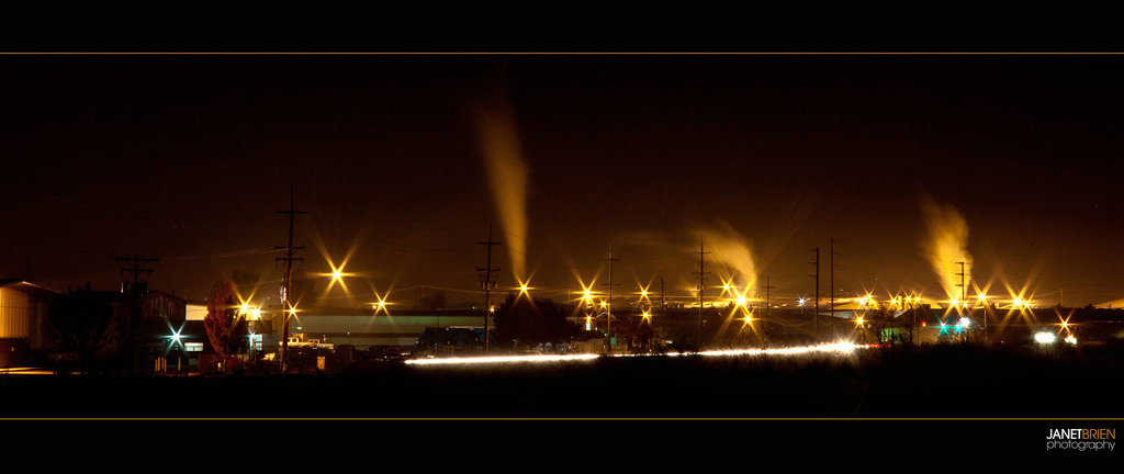 Stacks in the Distance with Cars Driving By