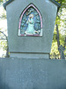 brompton cemetery, london,monument to dr.antoni kutek, 1954, with a ceramic plaque of gethsemane set into it