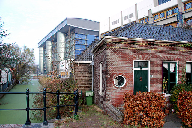 The Leiden University Medical Centre looming large over a old little building