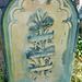 brompton cemetery, london,late c19 tombstone , illegible scroll over lilies