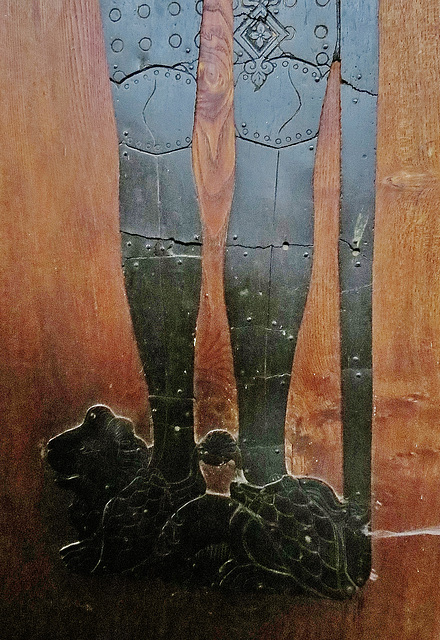 methwold church, norfolk,the leg armour on the  1367 brass of sir adam de clinton uses metal studs on leather breeches, shaped iron from the knees down, and snake like scales on his feet.
