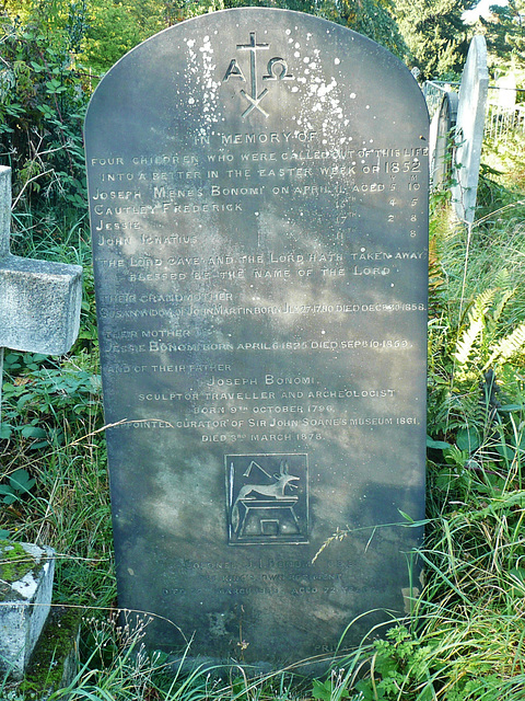 joseph bonomi's family tombstone; he was an egyptologist and architect, and died in 1878. they are his egyptian designs on the gravestone ., brompton cemetery, london