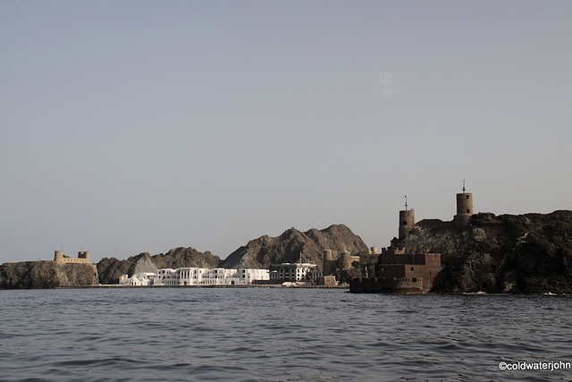 Muscat Palace and the bay guarded by Forts Jalali and Merani Muscat Palace and the bay guarded by Forts Jalali and Merani