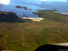 Aerial: View of Rwy 20 Island of Coll's new tarmac runway!