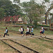 schoolchildren running to catch the train