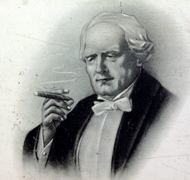 Cigar smoker on an old cigar tin