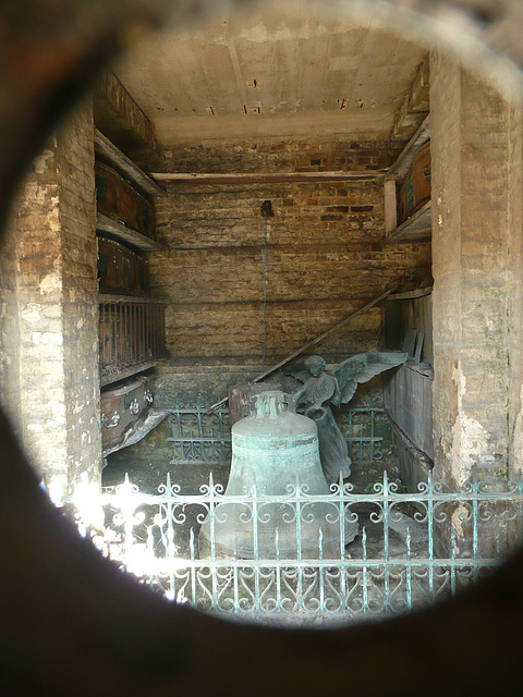 brompton cemetery, london,view inside the catacombs of 1838, built by baud.   the bell and angel appear to be from elsewhere in the cemetery.