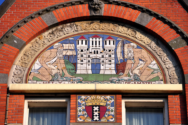 Tiles depicting the two rivers of Amsterdam: the IJ and the Amstel