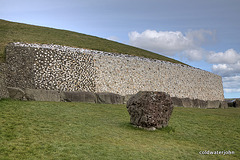 The controversial quartz and ovoid boulder reconstructed facade at Newgrange