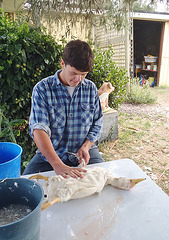 Konrad plucks a duck