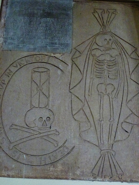 bromham church, wilts,incised skeleton, skull, hourglass on tomb on tower wall to ferdinando hughes, +1640 and two daughters +1647