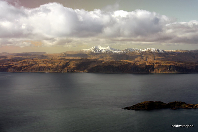 Mull's mountains in the distance from above Connel - aerial