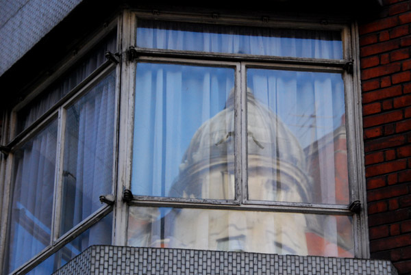 Reflection in window of Bedford Hotel