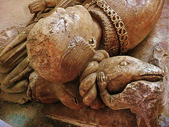 st.nicholas church, ash by sandwich,detail of the fish crest on the helmet under the head of  john de septvans , which rests on the angel's shoulder. john wears the ss collar of the lancastrians. he died in  1458 .