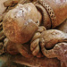 st.nicholas church, ash by sandwich,detail of the fish crest on the helmet under the head of  john de septvans , which rests on the angel's shoulder. john wears the ss collar of the lancastrians. he died in  1458 .