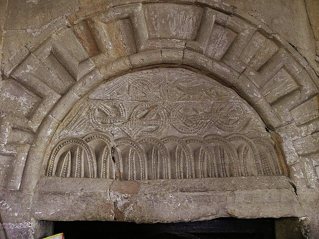 st.clement's , sandwich,this small tympanum with deer and dove is over the door to the central tower stair, c.1130