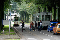 Crossing the street just in front of the tram
