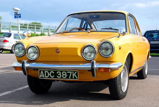 Little yellow Fiat 850 visiting Holland from England