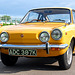 Little yellow Fiat 850 visiting Holland from England