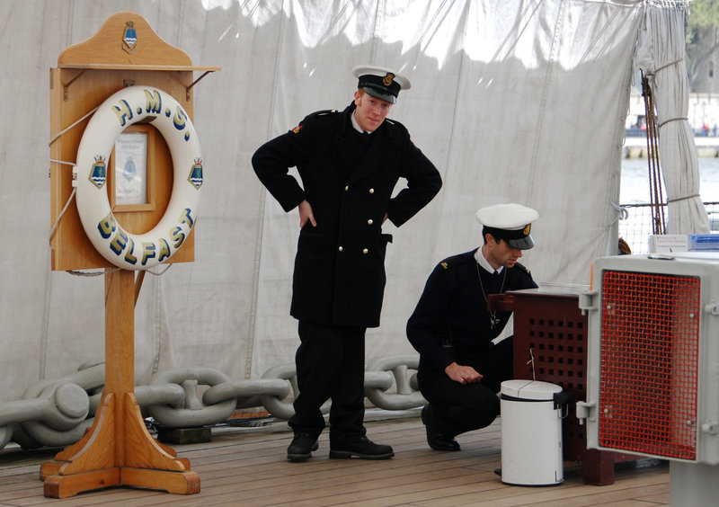 Men in uniform aboard HMS Belfast