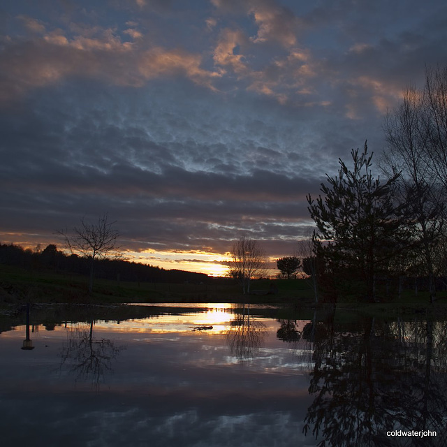 Dusk falls on stormy skies