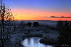 Sunset over the trout pond on a cold and frosty evening