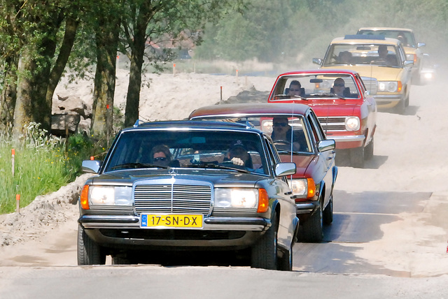 Mercedes-Benzes and an Opel