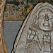 ightham church, kent,detail of the tomb of dorothy selby, 1641, by edward marshall. behind the effigy are representations of her needlework, with a stump work adam and eve above slate incised with her depiction of the dispersal of the armada, the revelati