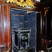 petworth house,c19 stove in a niche in the c17 woodwork