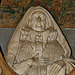 ightham church, kent,detail of the tomb of dorothy selby, 1641, by edward marshall. behind the effigy are representations of her needlework, with a stump work adam and eve above slate incised with her depiction of the dispersal of the armada, the revelati