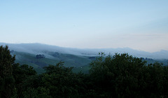 mist rolling in over the hills