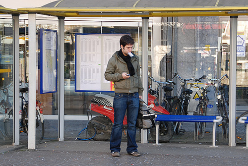 Waiting for the bus to arrive in Leuven (Belgium)