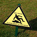 Dangerous wet grass in the form of an oil slick